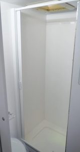 Glideaway-shower-door-open-white